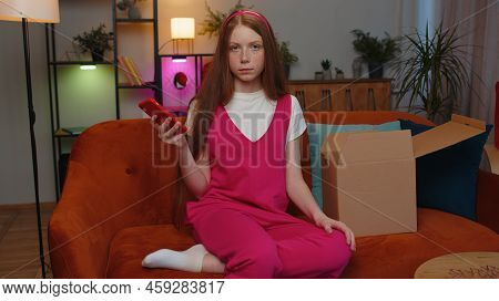 Angry Dissatisfied Shopper Teen Redhead Children Girl Unpacking Parcel Feeling Upset Confused With T