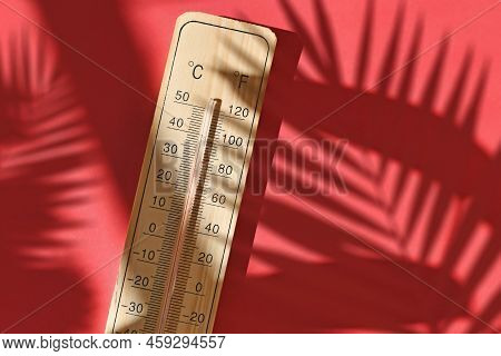 Wooden Thermometer Showing 40 Degrees Celsius Or 104 Degrees Fahrenheit During Summer Heat Wave