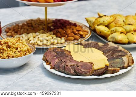 Table Served With Sliced Meat With Cheese, Dried Fruits And Nuts, And Other Dishes. Traditional Kaza