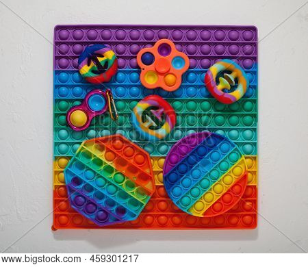 Popular Colorful Children's Toys (spinner, Simple Dimple, Pop It And Snapperz Toy)  Top View.