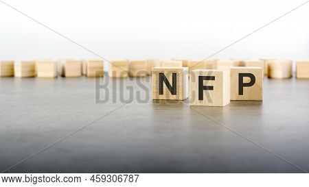 Word Nfp Is Made Of Wooden Blocks On Gray Background