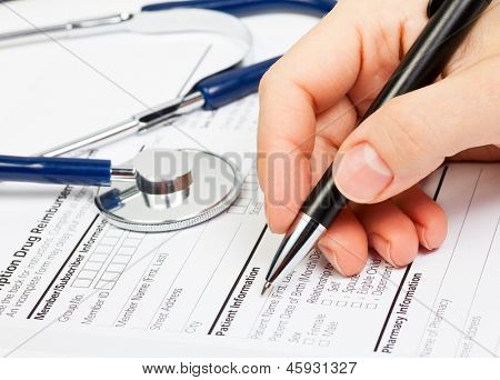 Doctor ready to fill patient information in Prescription form
