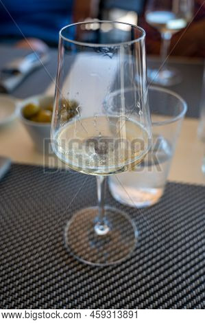 Drinking Of Txakoli Or Chacolí Slightly Sparkling Very Dry White Wine Produced In Spanish Basque Cou
