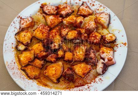 Tasty Seafood, Grilled Octopus Galician Style With Red Pimento Paprika And Potatoes