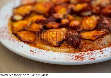 Tasty Seafood, Grilled Octopus Galician Style With Red Pimento Paprika And Potatoes