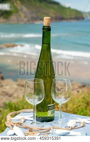Tasting Of Txakoli Or Chacolí Slightly Sparkling Very Dry White Wine Produced In The Spanish Basque