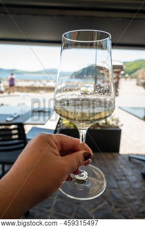 Drinking Of Txakoli Or Chacolí Slightly Sparkling Very Dry White Wine Produced In Spanish Basque Cou