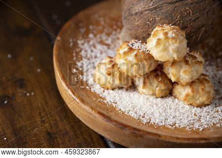 Coconut Cookies. Homemade Gluten Free Pastry With Coconut. Small Round Sweets On A Wooden Table. Hig