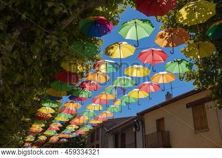 Umbrellas As A Roof On The Main Street Of Leran In Is A Commune In The Ariege Department In Southwes