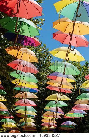 Umbrellas As A Roof On The Main Street Of Leran In Is A Commune In The Ariege Department In Southwes