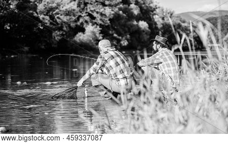 Two Male Friends Fishing Together. Big Game Fishing. Relax On Nature. Happy Fishermen Friendship. Re