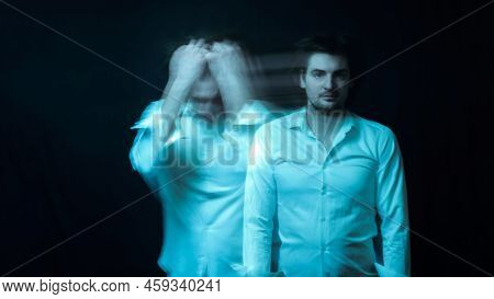 Schizophrenic Abstract Blurry Portrait Of Man With Mental Disorders And Mental Illnesses On Dark Bac