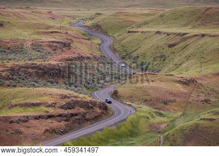 Scenic Road In The Countryside By Green Farm Fields. Near Washtucna, Washington, United States.