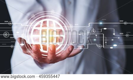 Young Businessman Holding A Virtual Globe In His Hand, New Technologies, Big Data, And Business Proc