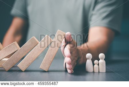 Young Man Using Hands To Prevent Falling Trees, Care Concept, Protect, Keep Family Members Safe And 