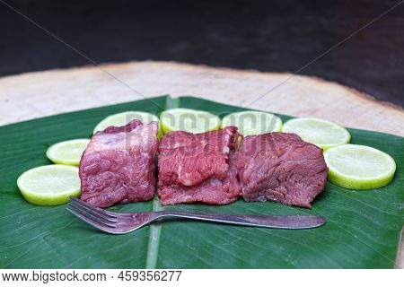 Cow Beef With Sliced Lemon And Spoon