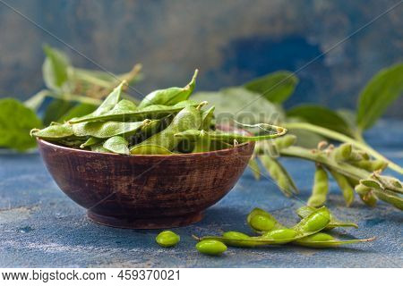 Raw Green Edamame Soybeans. Edamame, Fresh Green Soybeans In Pod. Healthy Vegan Food.