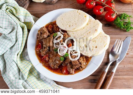 Fine Meat - Beef Goulash In A With Red Pepper On Wooden Table. Top View