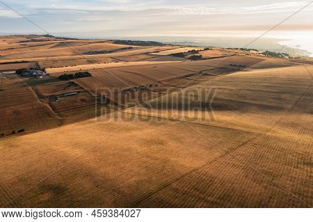 Stunning Aerial Drone Landscape Image Of Golden Hour Over Farmers Fields In South Downs National Par