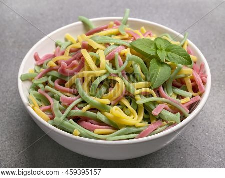 Colored Noodles From Durum Wheat Based On Vegetables And Herbs. Pasta Flavored With Spinach, Beetroo