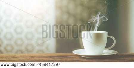 White Cup Of Coffee On Wooden Beside Wondow