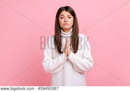 Female Holds Hands In Prayer, Looking With Imploring Pleading Expression, Begging Help, Forgiveness,