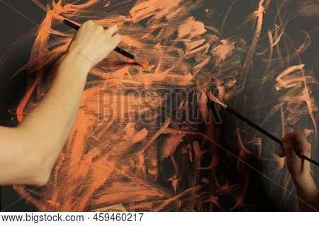 People Painting Canvas Creation With Orange Color, Using Watercolor Aquarelle Paint And Paintbrush. 