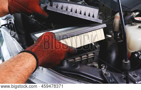 Car Air Filter Being Inserted Into Air Filter Box In The Automobile Engine Compartment By Auto Mecha
