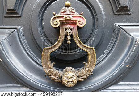 European Vintage Old Metal Wrought Iron Door Knocker. Design Detail. Paris.