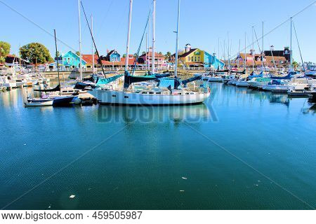 August 5, 2022 In Long Beach, Ca:  Sailboats And Yachts Docked At The Marina Surrounded By Colorful 