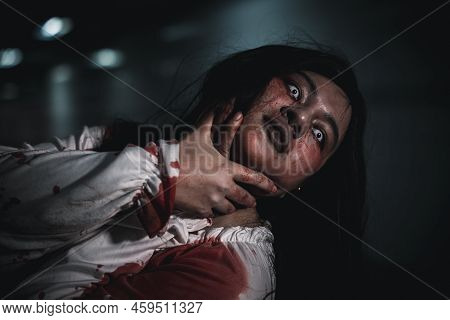 Horror Bloodthirsty Woman Ghost Or Zombie She Is Horror Scary With Breaks Her Neck At Dark Night, Sc