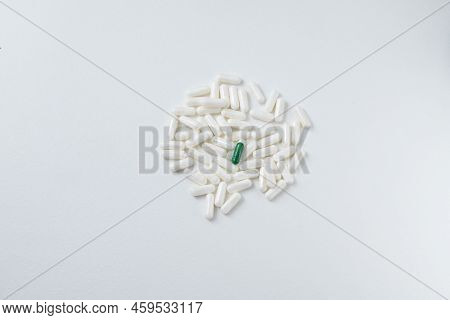 Pile Of White Pills On White Table. Top View Of Pile White Pill Painkiller.
