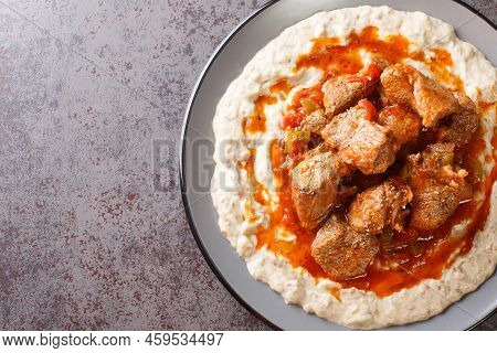 Turkish Hunkar Begendi Meat On A Bed Of Baked Eggplant With Bechamel Closeup In The Plate On The Tab