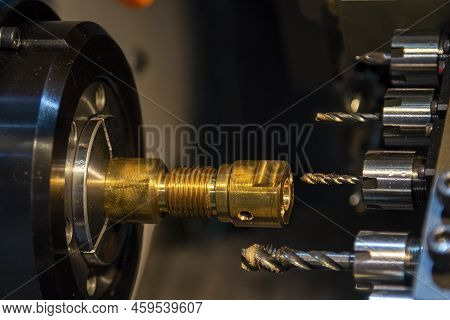 The Multi-tasking Cnc Lathe Machine Swiss Type Tapping The Brass Shaft Parts. The High Technology Me