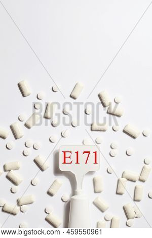 Titanium Dioxide, E171, Dangerous Additive Concept. Gum, Pills, Toothpaste Or Cream And Sign With E1