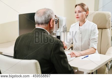 Ophthalmologist Examination Of Elderly Man On Corneo Topographer.modern Clinic
