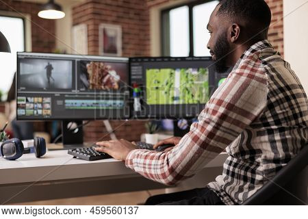 African American Filmmaker Creating Video Footage Using Editing Sofware To Make Post Production Cont