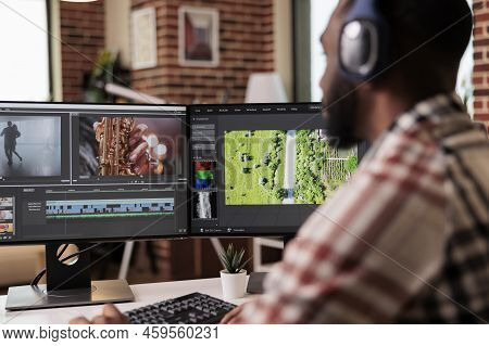 Graphic Designer Editing Footage On Software, Working To Edit Video Montage With Color Grading And A