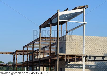 Installation Of Metal Trusses And Frame During The Construction Of An Industrial Building Or Factory