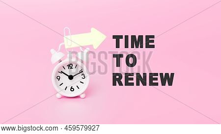 White Alarm Clock In Pink Background With Text - Time To Renew. The Concept Of Business, Motivation 