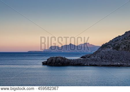 A View Of The East Coast Of The Island Of Rhodes At Sunset, Greece, Europe.