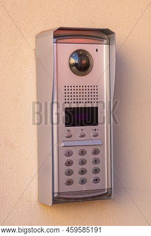 Intercom Doorbell And Access Code Panel On Wall Of Residential Building