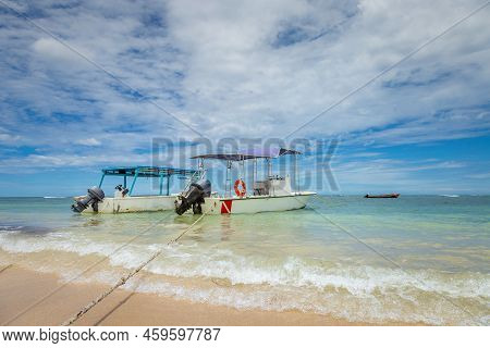 Dramatic Sky With Storm Clouds Over Caribbean Beach With Motorboat, Negril Seven Mile Beach, Jamaica