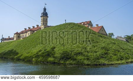 Moat Of Old Castle. Moat With Reflection In The Water And Trees. Sunny Summer Day. Palace, Tower, Co
