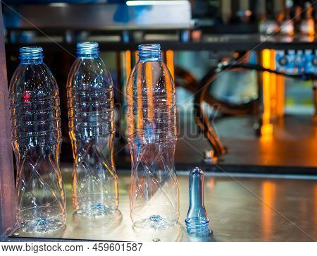 Plastic Bottles And Raw Material For Plastic Bottle Manufacturing Process On Plastic Bottle Blowing 