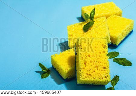Bright Yellow Sponges For Washing Dishes. Organic Cleaning Concept, Minty Freshness