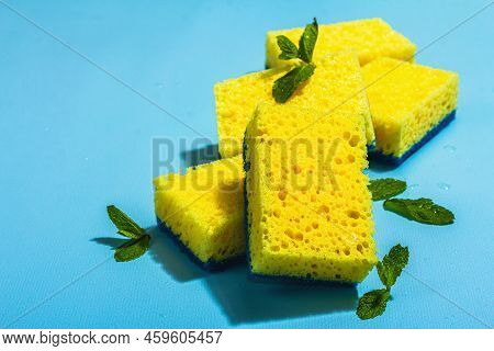 Bright Yellow Sponges For Washing Dishes. Organic Cleaning Concept, Minty Freshness