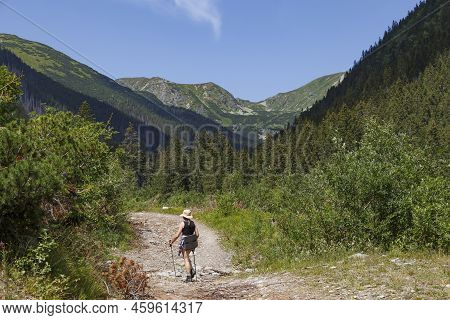 Pedestrian Tourist - Girl Hiking On Mountain Path. Summer Mountain Forest Landscape. Rackova Valley.