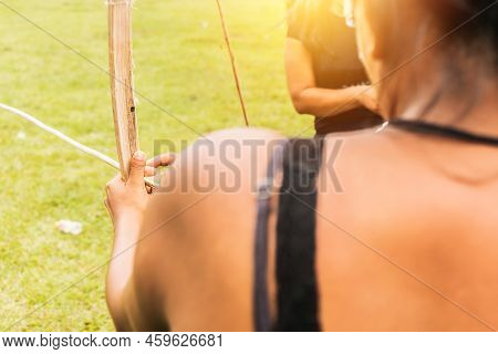 Unrecognizable Indigenous Woman From Nicaragua, Central America, Practicing Archery And Arrow