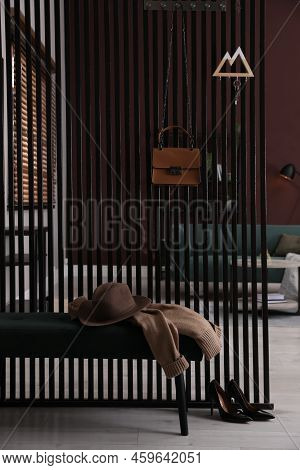 Key Holder On Black Wooden Folding Screen In Room